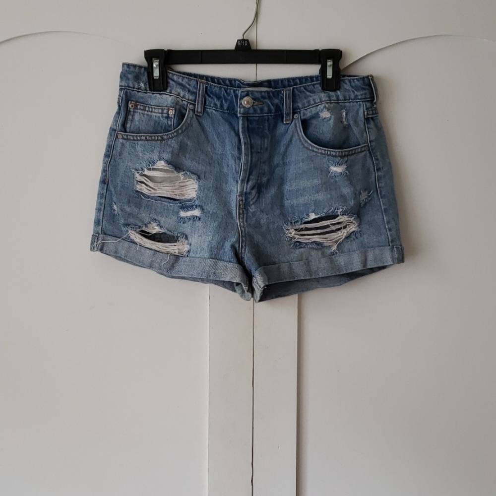 Distressed light blue shorts